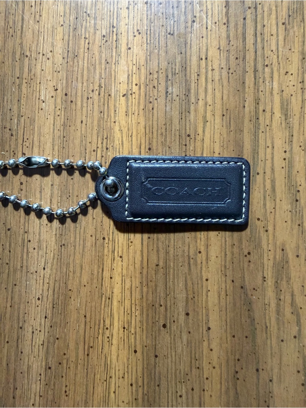 Coach Dark Brown Leather Rectangular Hangtag with White Stitching